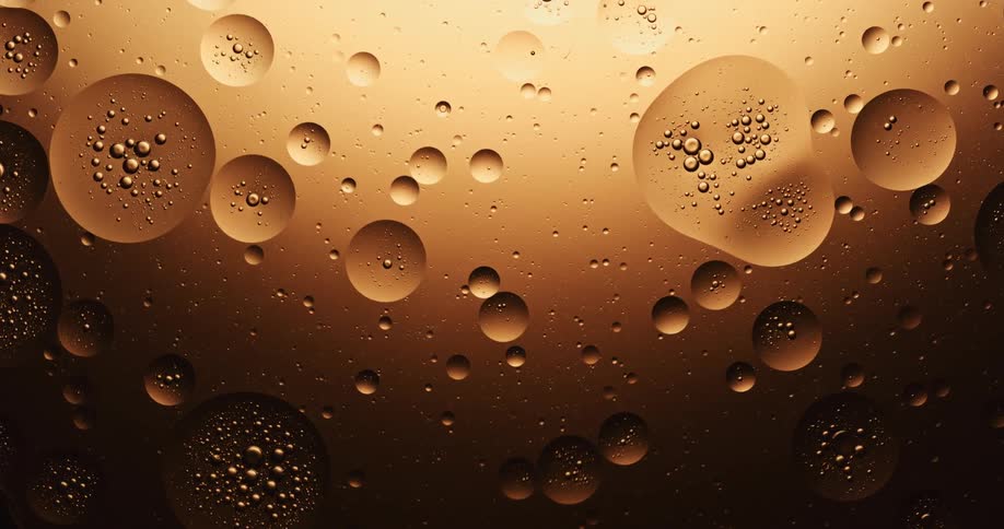 Bubbles some containing other bubbles separate and merge as they flow