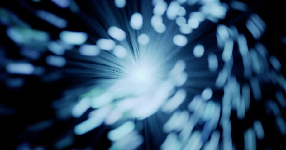 Cluster of filaments with glowing tips that change from blue to green contrast with black background