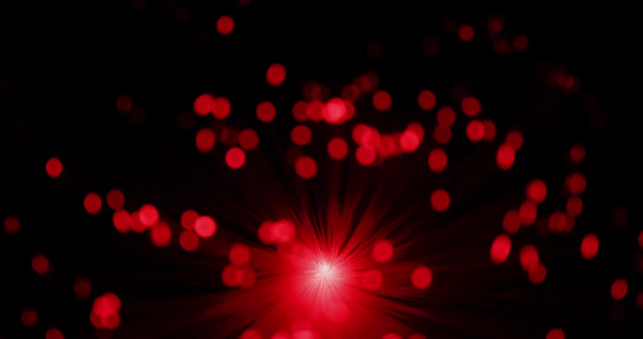 Orbs of red lights moving forward