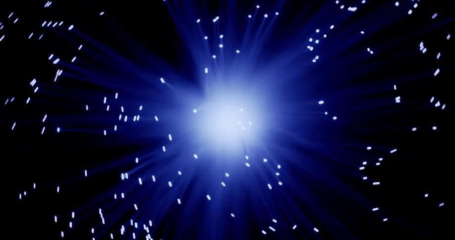 A flare is glowing in the darkness and as the blue rays move and warp many pinpoints of light move with them