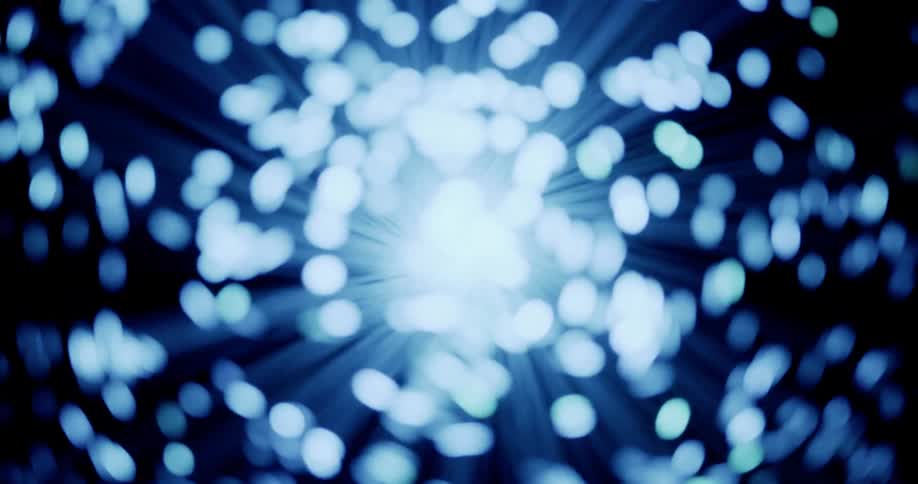 Lights glow on the ends of thin illuminated fiber moving in the darkness