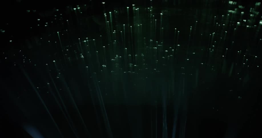 Several small points of light appear to be shining on a dark surface overhead