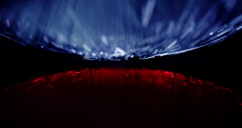 Blue filaments with glowing tips reflect redon dark surface