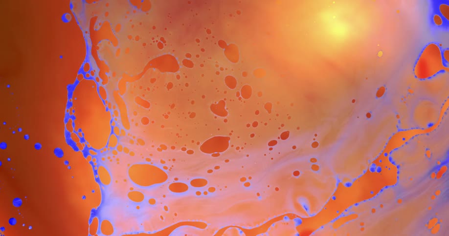 Blue spots emerge in an orange substance and are filled with orange and yellow as they stretch and grow and then shrink