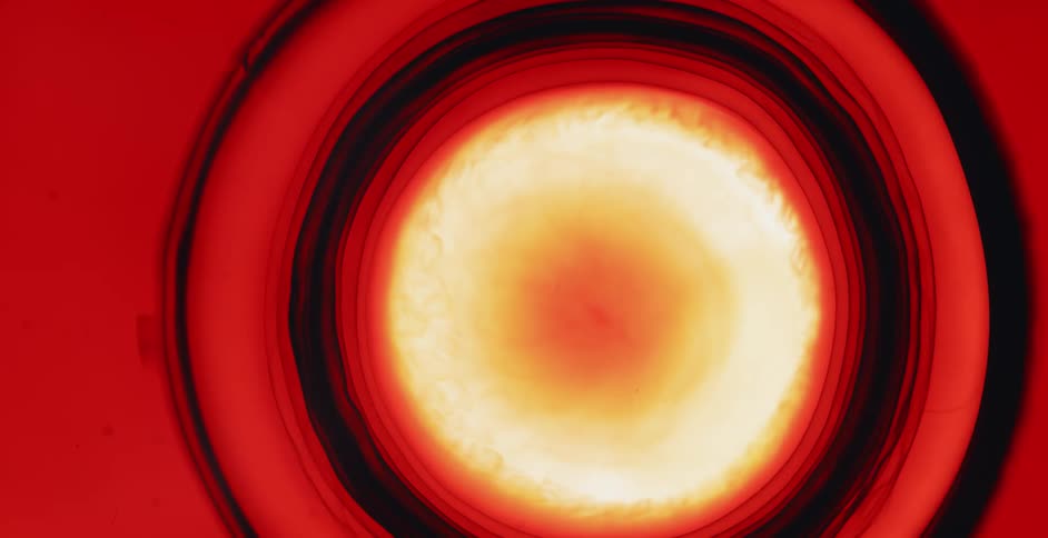 Liquid from a dropper spreads into concentric circles
