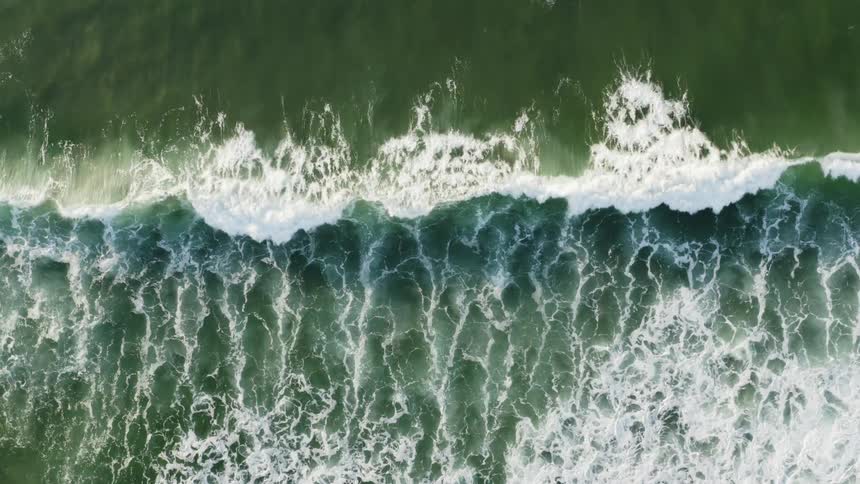 The view is of the ocean and the waves outside
