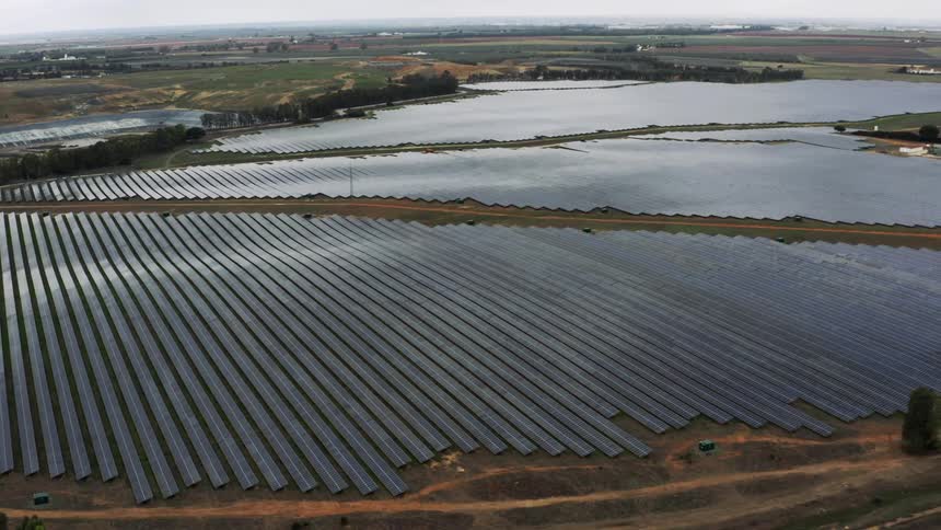 Aerial view of a large solar farm in the countryside during the day