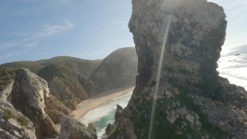 Aerial view of ocean coast is displayed in the daytime