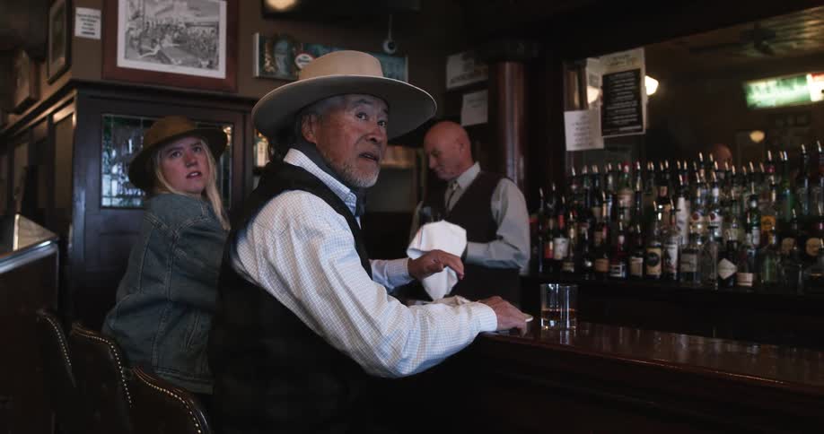 People at the bar turn around