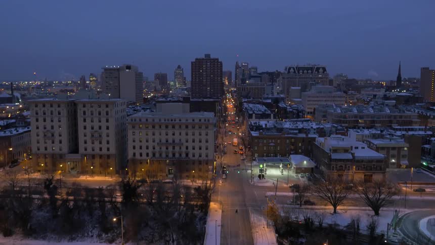 A freeway, city and city lights at dusk in winter