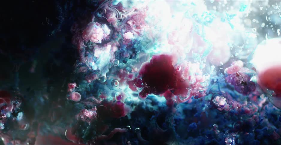 Abstract footage of bubbles in liquid with paint