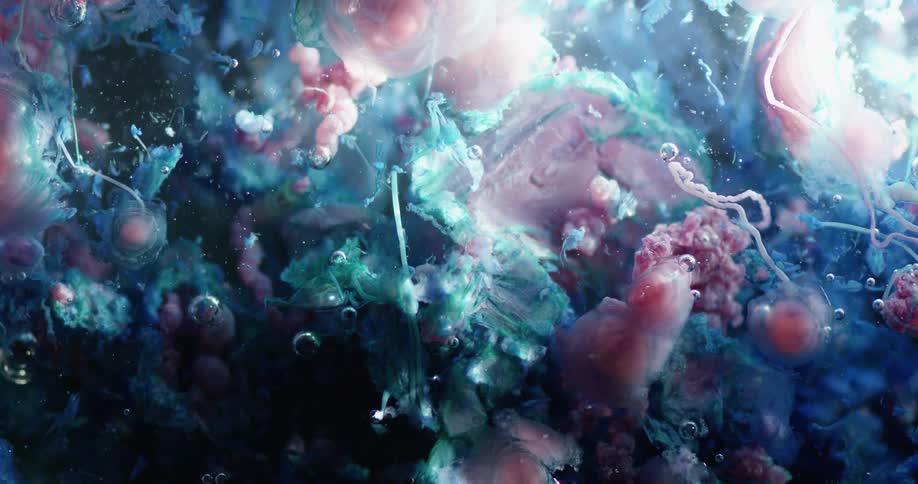 Digital art shapes in blues and pink colors move on the screen