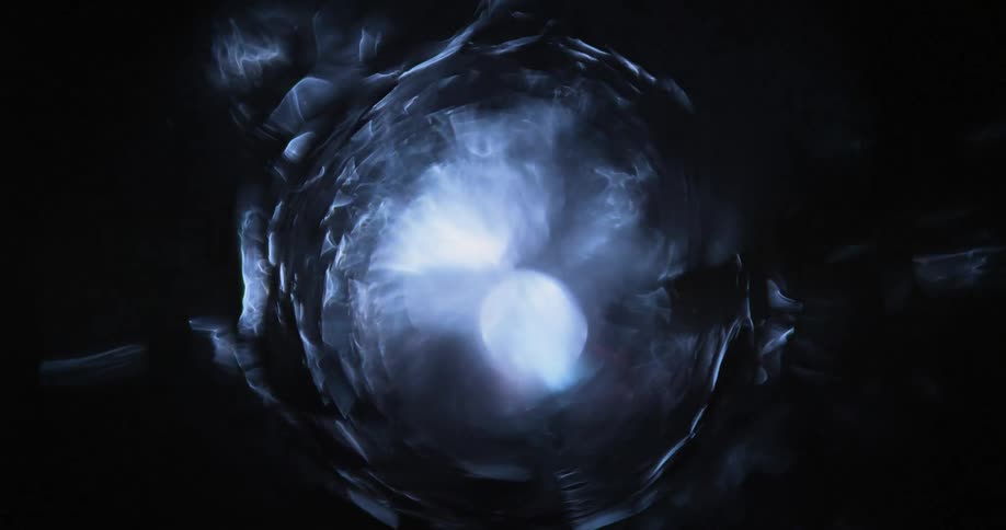 A light is flickering at the end of a tunnel causing a kaleidoscope effect