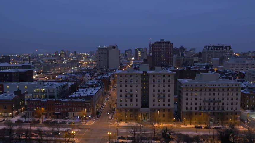 Traffic flowing through a city at dusk