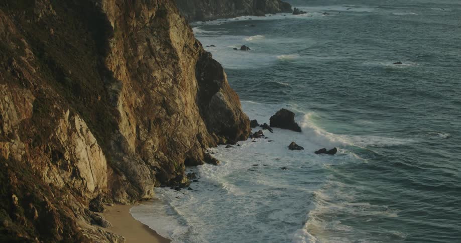 The view is of the ocean waves and you can see the cliffs as well