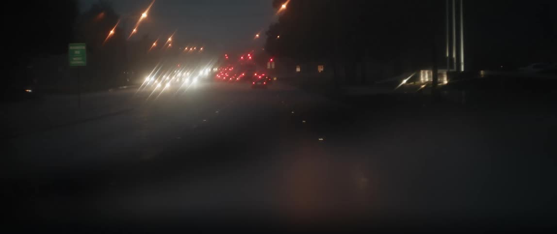 Cars are driving in the rain during traffic