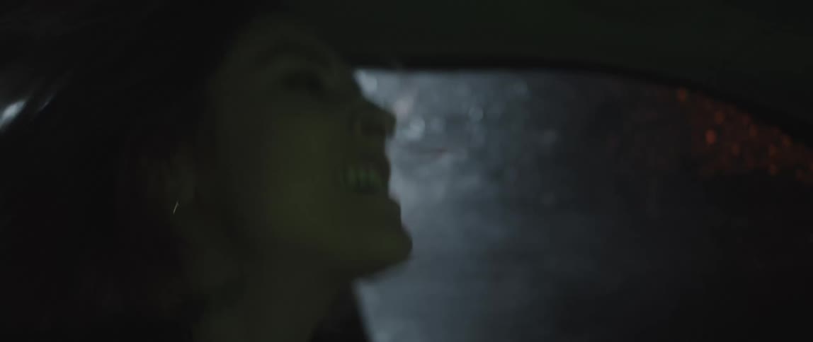 Excited woman shakes and screams singing inside a car driving in the rain at night