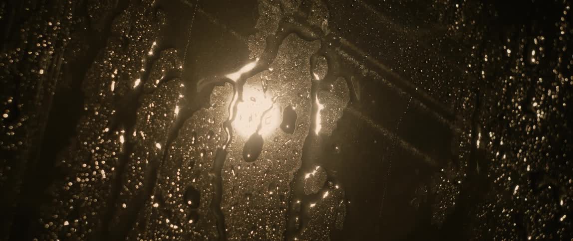 The rain is falling on the window