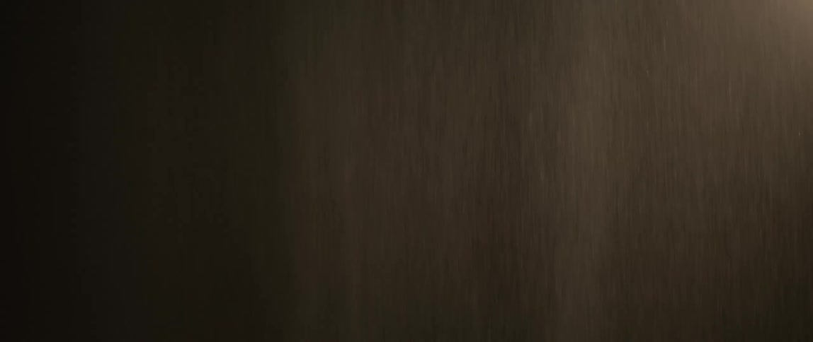Rain forms a curtain while falling through the night sky