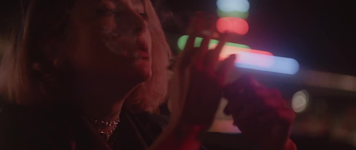 A woman is smoking a cigarette