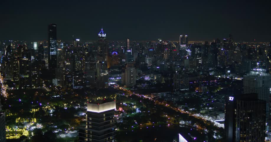 Downtown city lights shine brightly at night