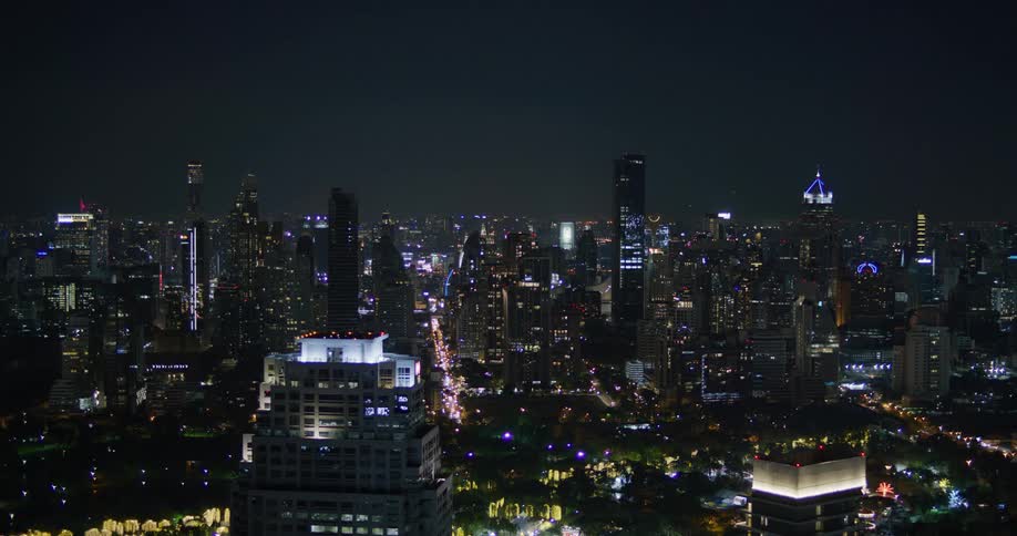 Illuminated skyscrapers and buildings in the city at night