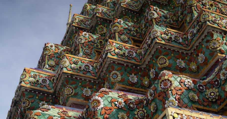 Angular corners protrude from the building adorned in colorful tiles and floral patterns