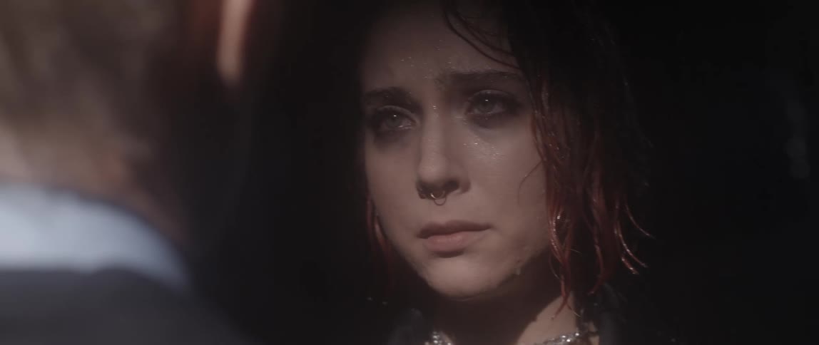 Woman walks forward tearfully to meet man shes missed at night