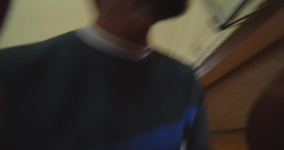 Pov shot playing basketball with a group of friends indoors