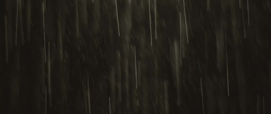 It is raining outside at night time