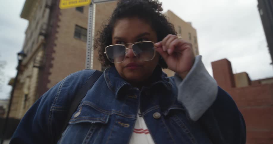 A woman looking over her glasses