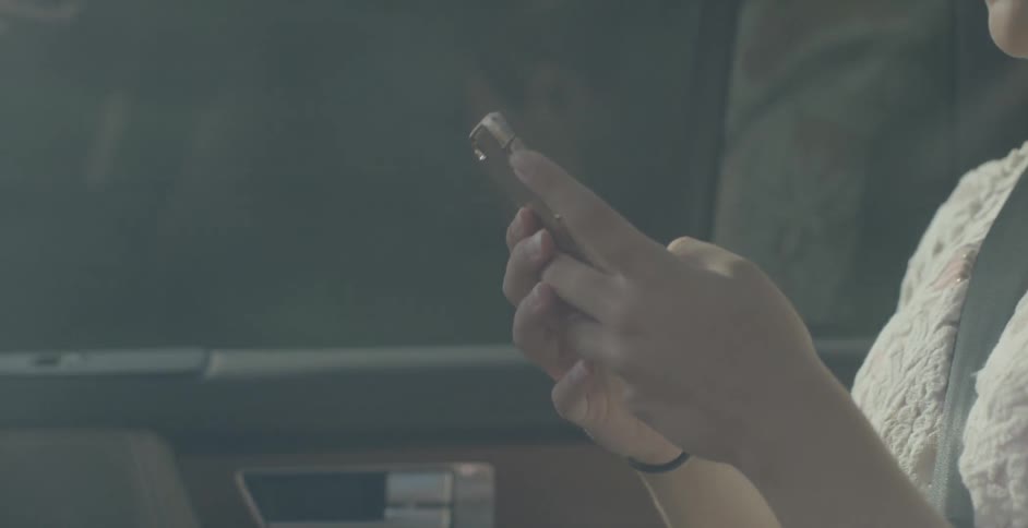 A person typing on their phone
