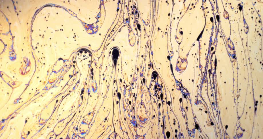 Yellow paint combined with black and purple swirling together