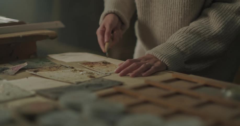 A person is woodworking with a tool