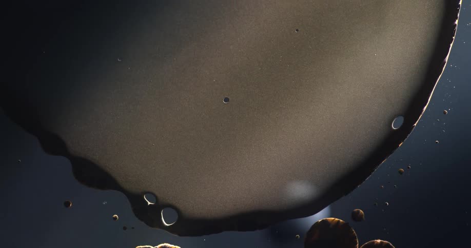 Flowing liquid and droplets suspended in water