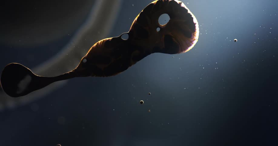 Droplets and dark liquid suspended in water