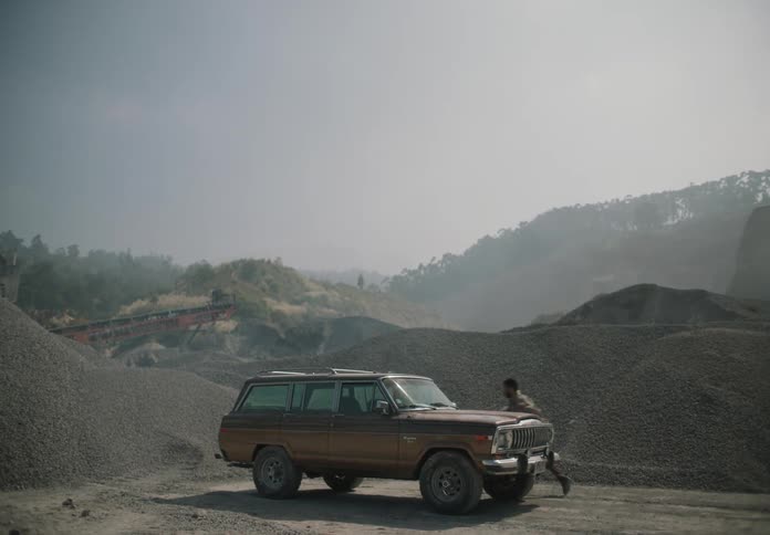 The man runs to his vehicle