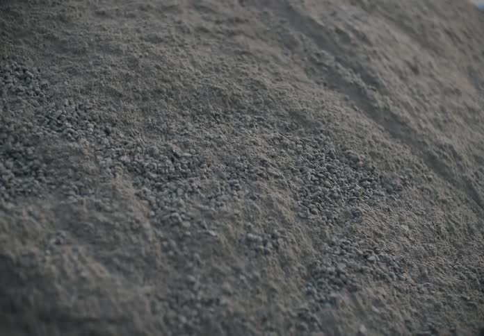 Sand rolls down the side of a hill