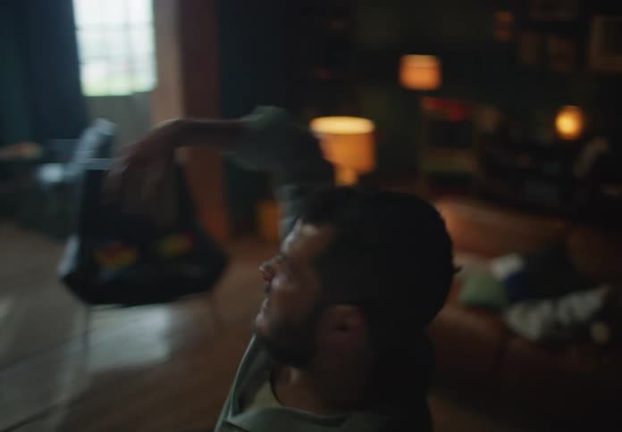 A man spins as he dances at home