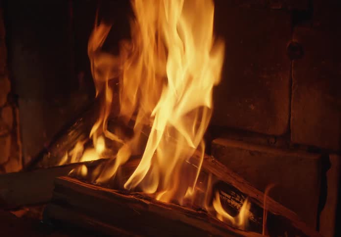 Fire burning in a stone fireplace