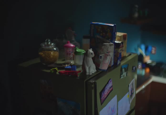 Food and items on a fridge in a home shake during a earthquake