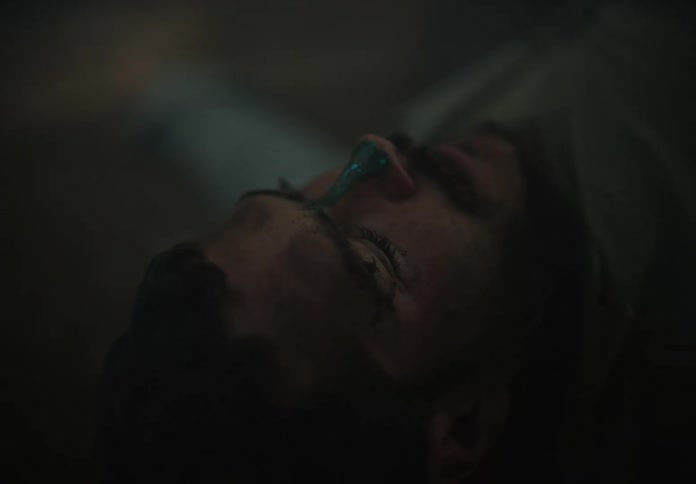 Man laying on the floor unconscious wakes up slowly