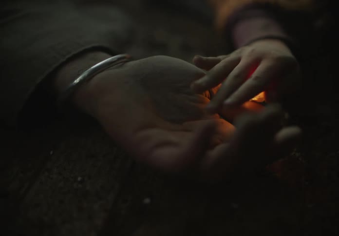 A child holds a persons hand