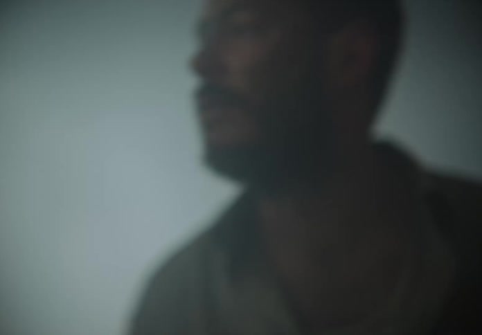 Desperate man looks around in foggy area