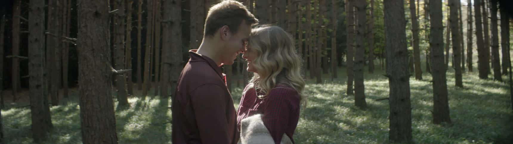 A man and women touch foreheads together
