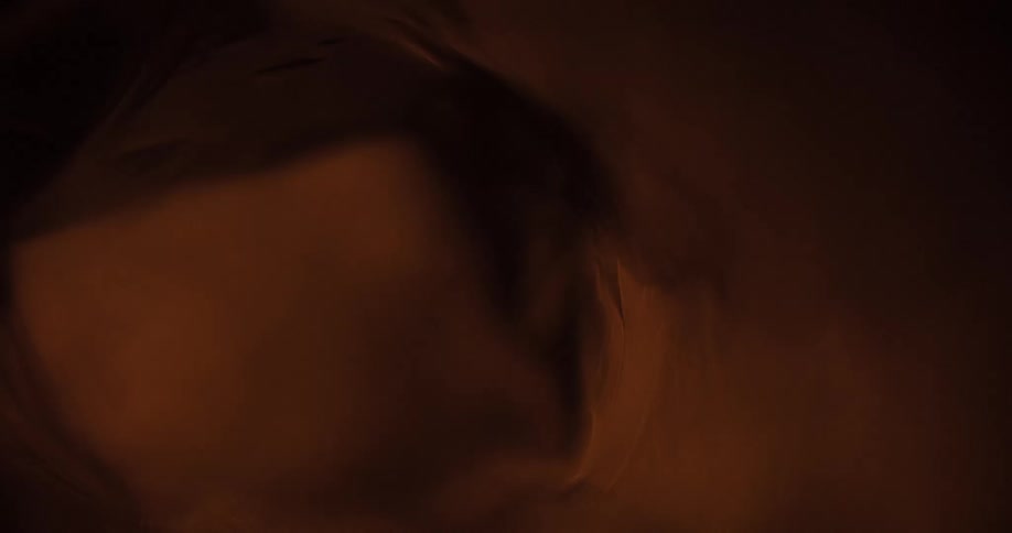Lights flicker and flash upon a blurry image that is refracted and distorted