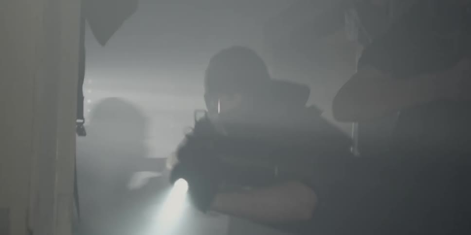 Men with masks and guns entering a home