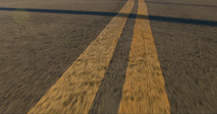 Lane markings on a road during the day