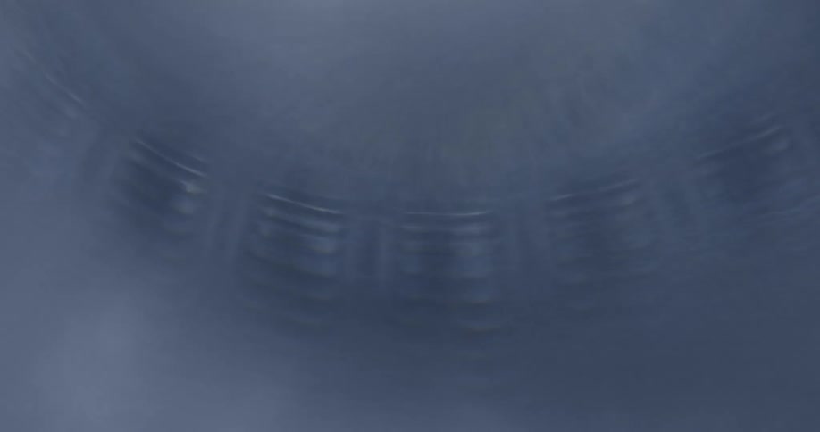 Light brightens across textured frosted surface showing glimpse of metallic pattern