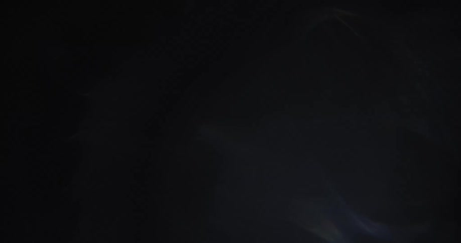 Vague reflections and subtle flares of lights on a black background